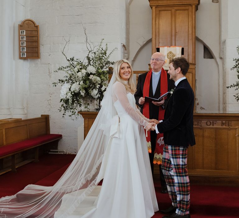 Bride and groom at their church wedding ceremony at St Monans Kirk church 