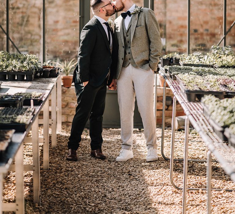 Glasshouse at Elmore Court for cute wedding couple portrait of two grooms at gay wedding 