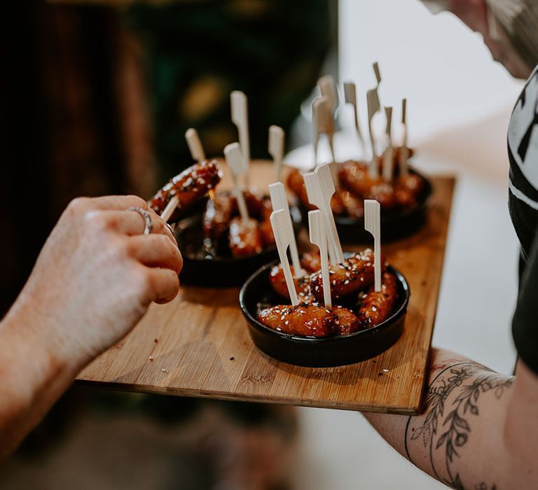 Sticky wedding canapés with sesame seeds for guests 