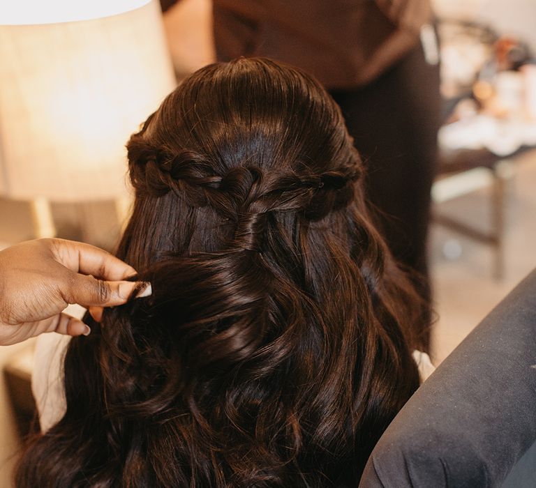 Bride wearing princess half up half down wedding hairstyle 