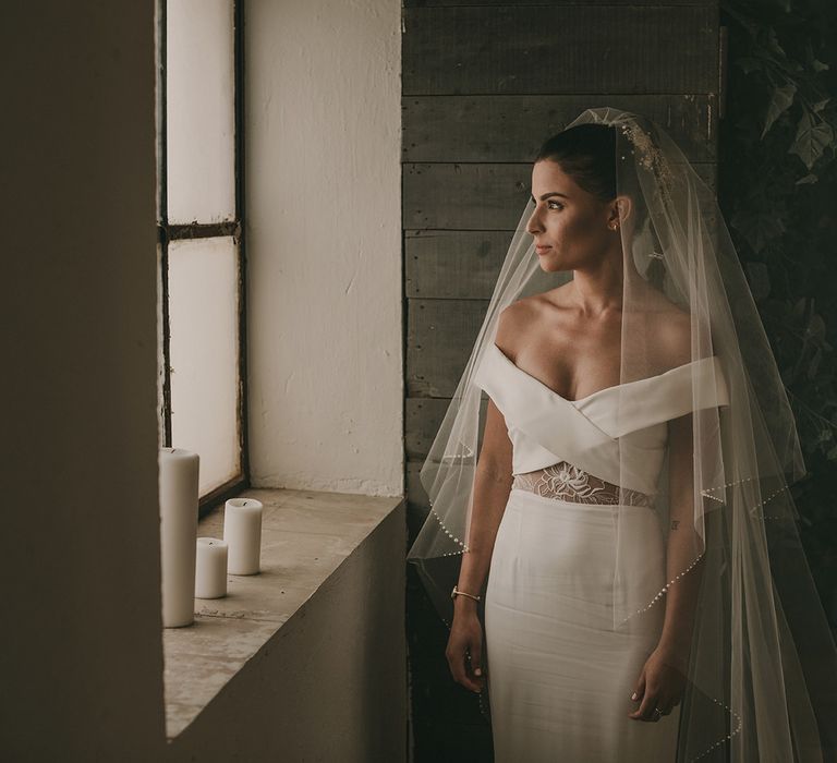 Bride in off the shoulder Rime Arodaky wedding dress and veil 