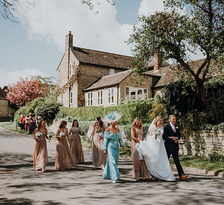 Bridal party walking to the wedding