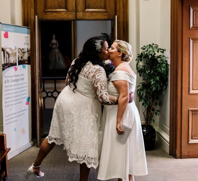 Brides kissing at St Georges Hall Liverpool Wedding