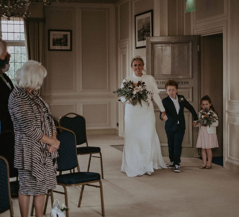 Wedding ceremony bridal entrance with her children 