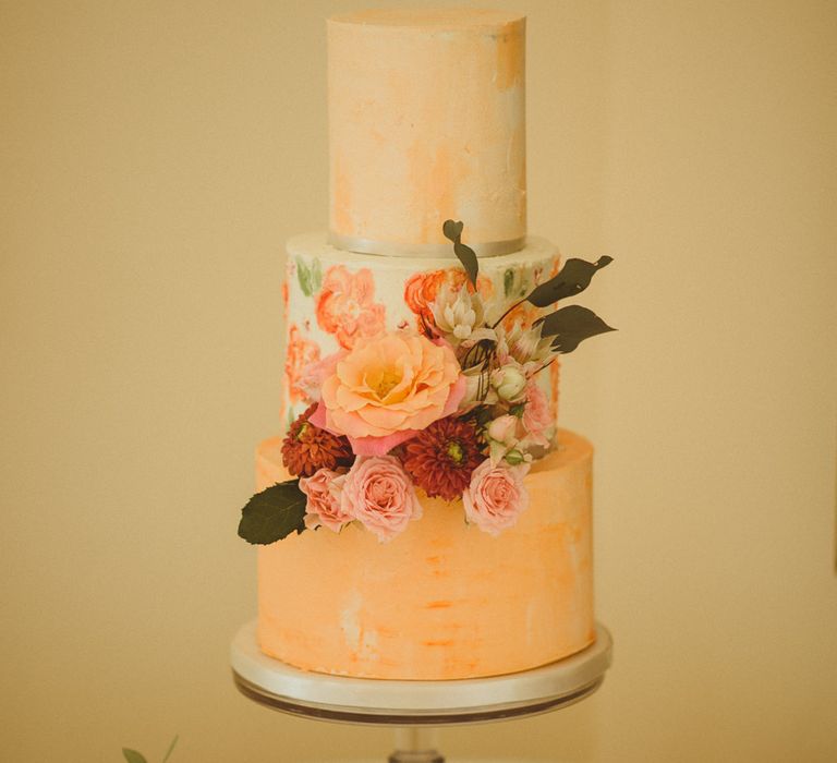 Three tier wedding cake with floral layers 