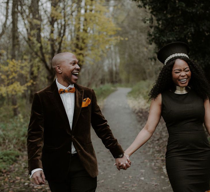 Black African bride and groom portrait in a country lane by Jennifer Moyes Photography