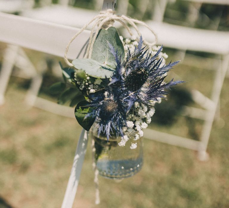 Thistles and eucalyptus flower aisle decorations