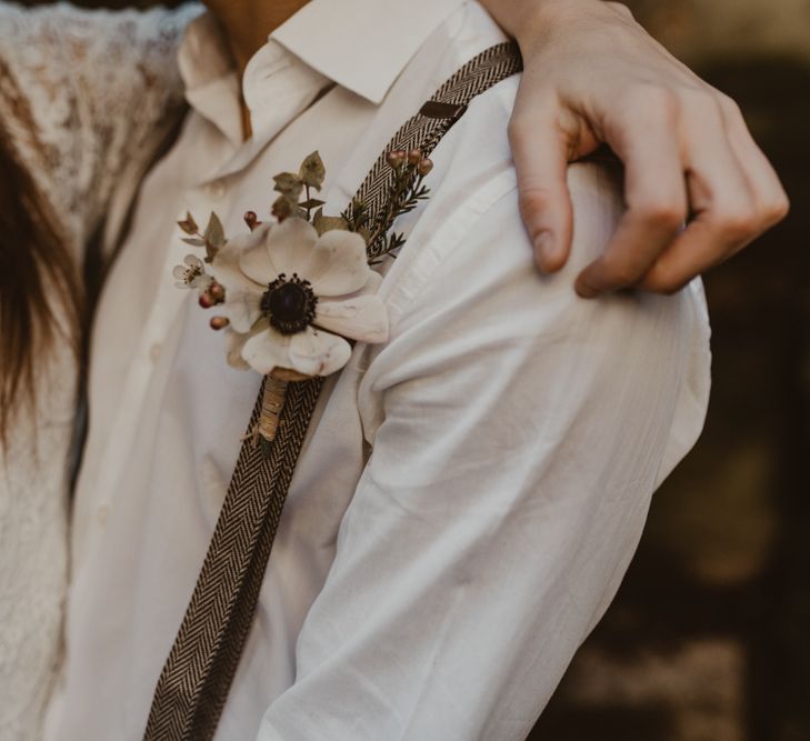 Dogtooth braces with anemone buttonhole | Nesta Lloyd Photography 