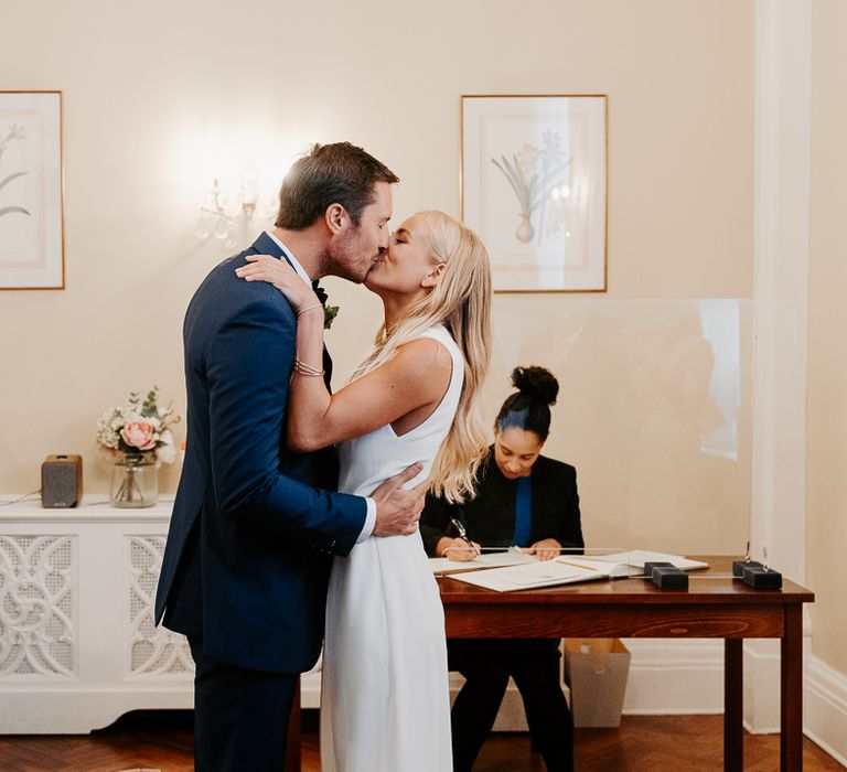 Bride & groom kiss during ceremony at Chelsea Old Town Hall