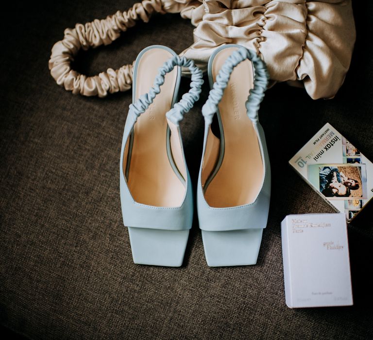 Cornflour blue square open toe slingback heels, ivory flat fifteen bag and polaroid film for Harrogate wedding