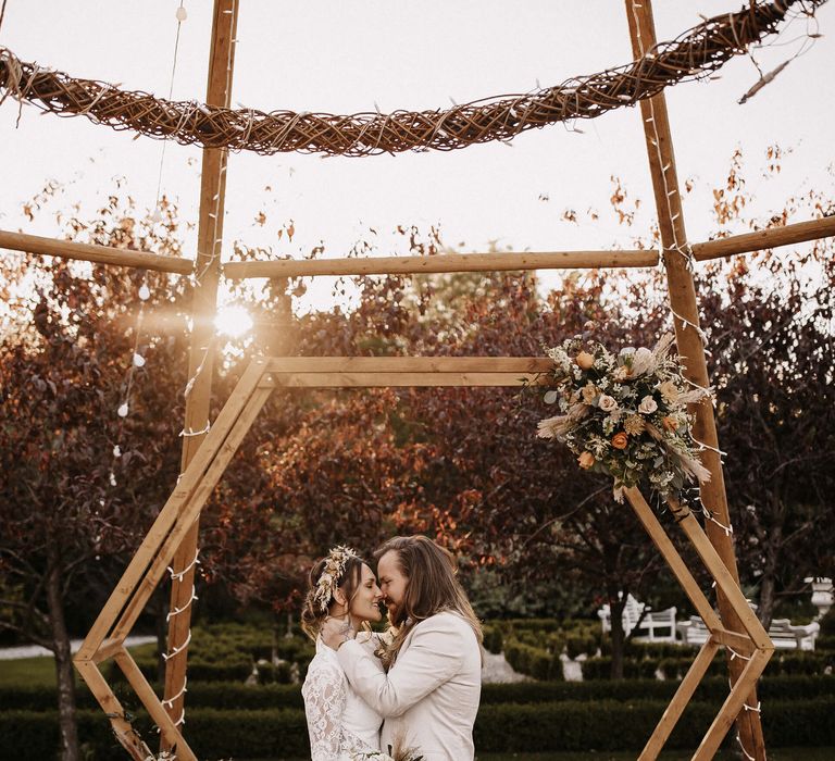 Naked tipi wedding ceremony at The Secret Garden Kent with Hexagonal wooden altar 