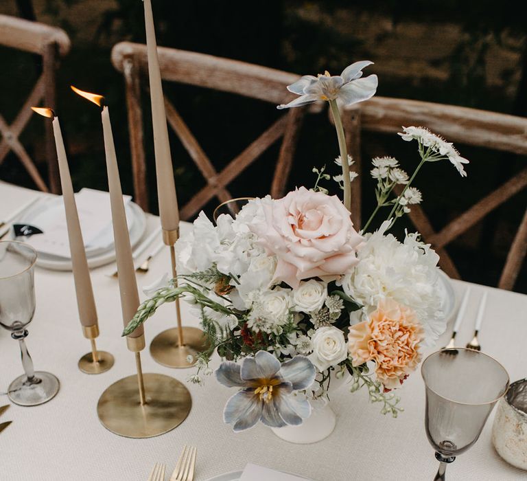 Romantic white and peach wedding flower centrepiece with roses, dahlias and irises 