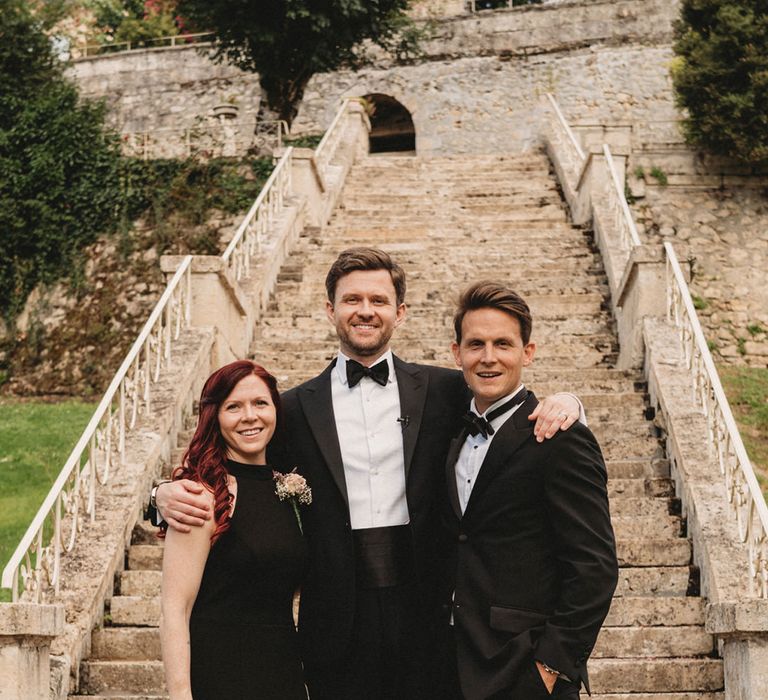 Groom in a tuxedo with his best man and best woman at Chateau Lagorce destination wedding 