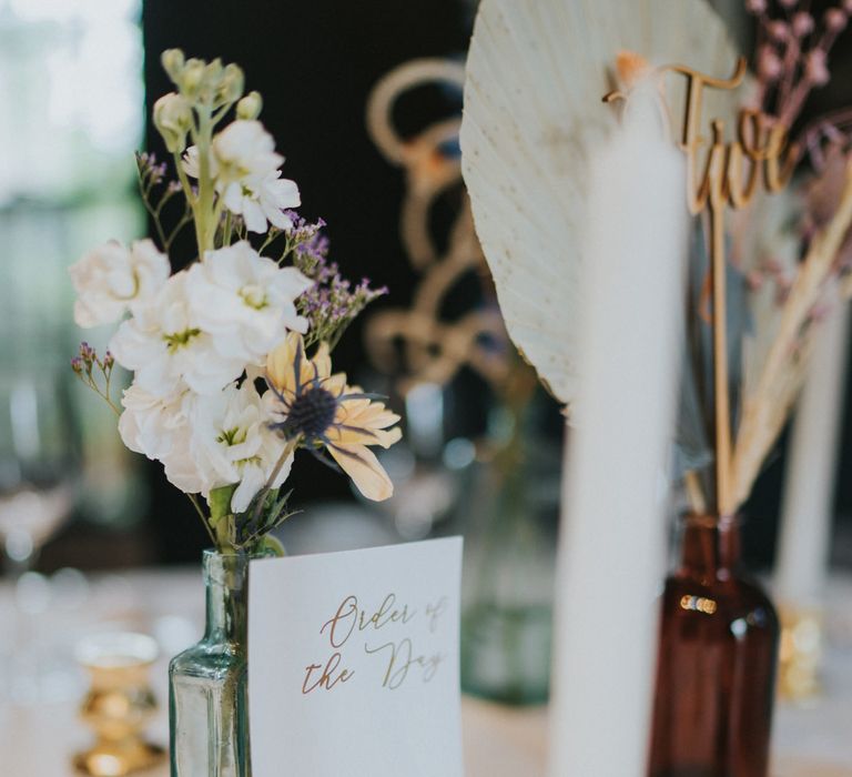 Gold details and table numbers for wedding in townhouse