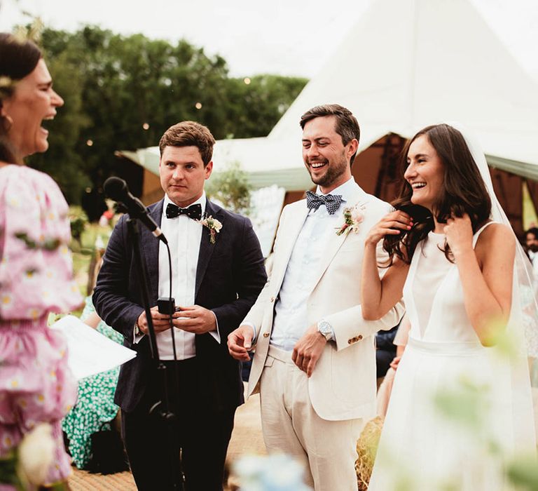 Bride & groom laugh on their wedding day