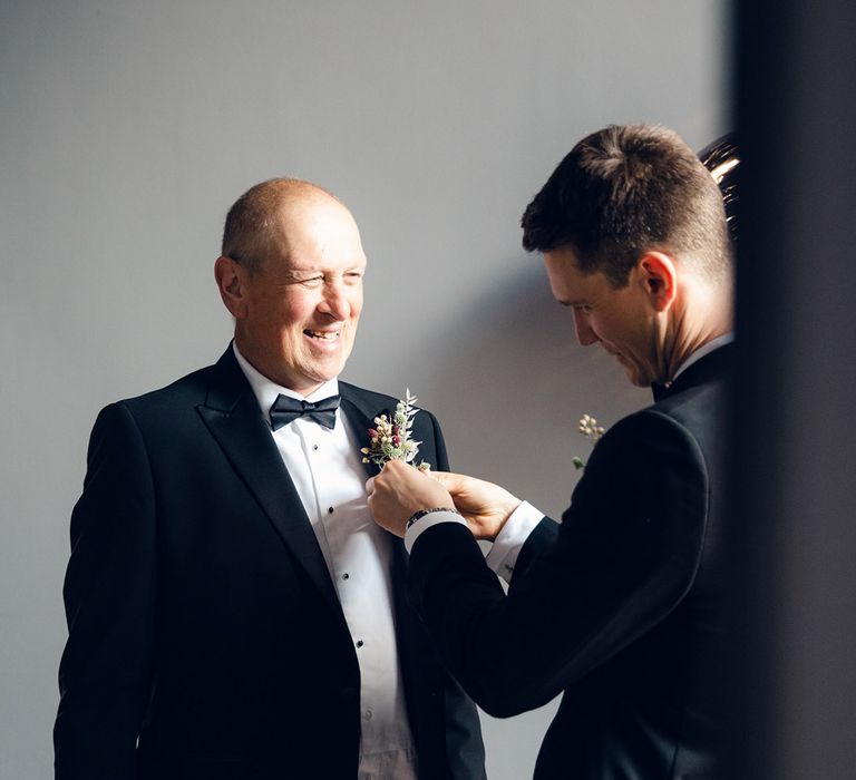 Black tie wedding with floral buttonholes