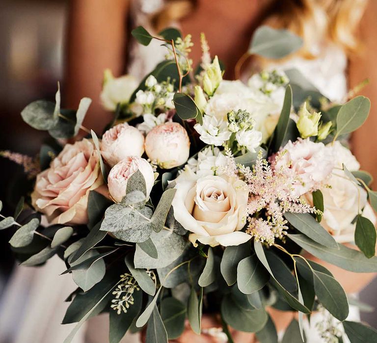 Pink and white wedding bouquet with greenery for bride 