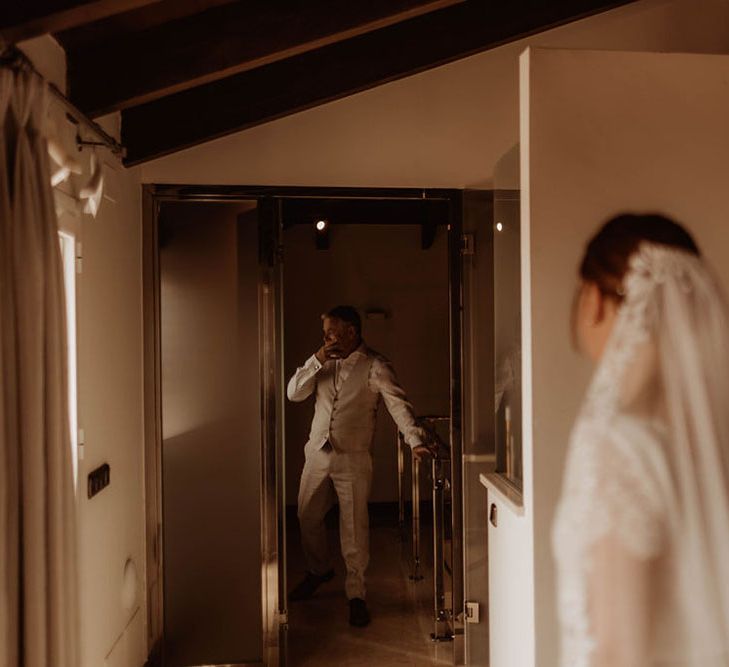 Brides father sees her for the first time in first look moment on the morning of her wedding day