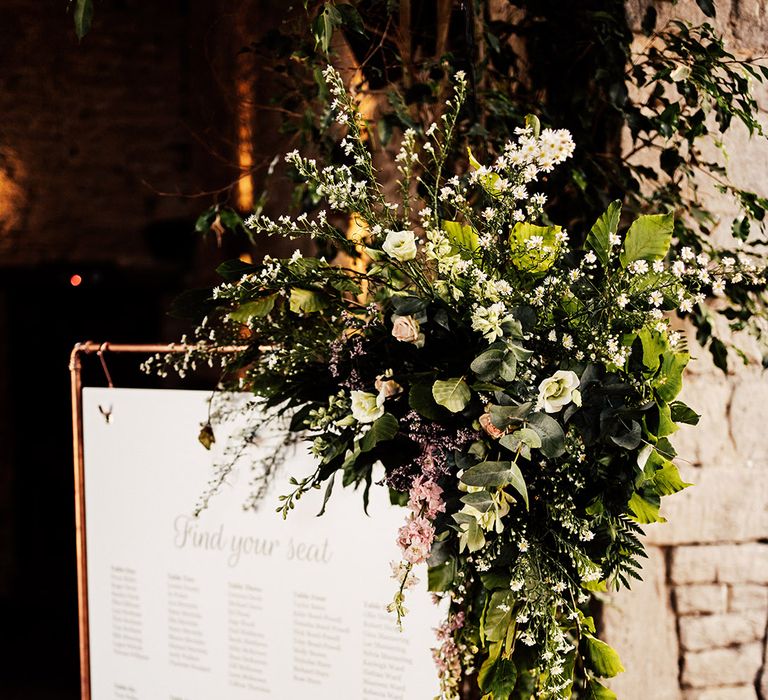 Copper frame wedding seating chart with foliage and flowers for Cripps Barn wedding 