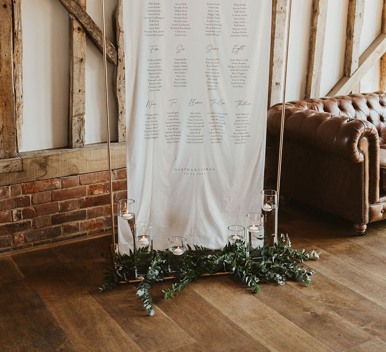 Black and white wedding seating plan chart for classic barn wedding 