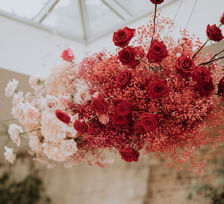 Red rose and gypsophila flower cloud with light pink colour combination 