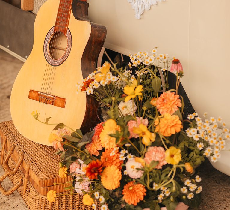 Guitar and wedding flower decorations with orange colour palette 