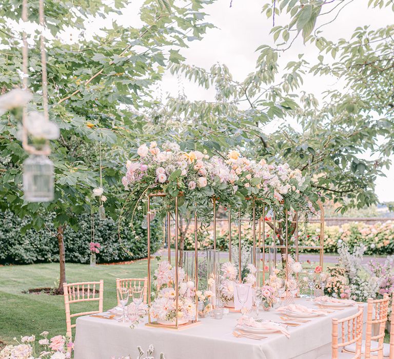 2024 Pantone Colour of the Year 2024 is peach fuzz and this romantic tablescape is filled with peach flowers and decor 