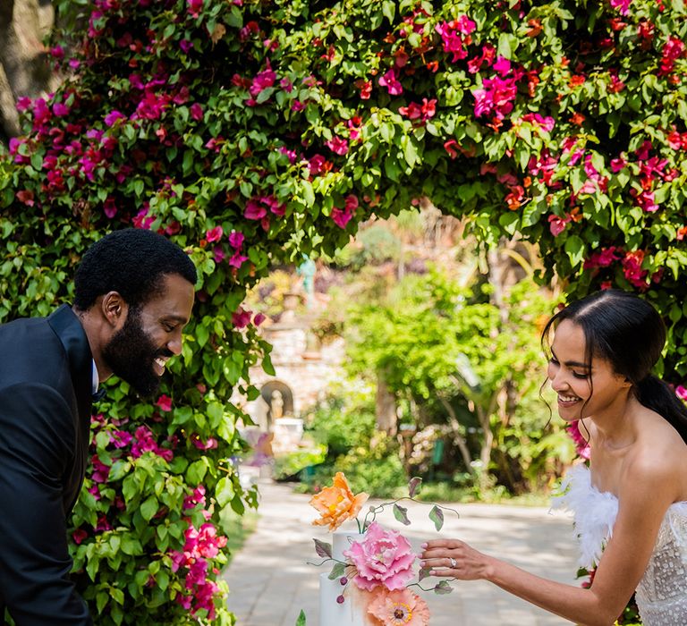 South Africa wedding with colourful wedding flowers and decorations with white iced wedding cake 