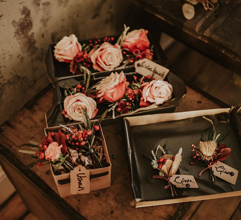 Dried flowers and rose buttonhole accessories for the wedding party at LGBQTIA+ wedding 