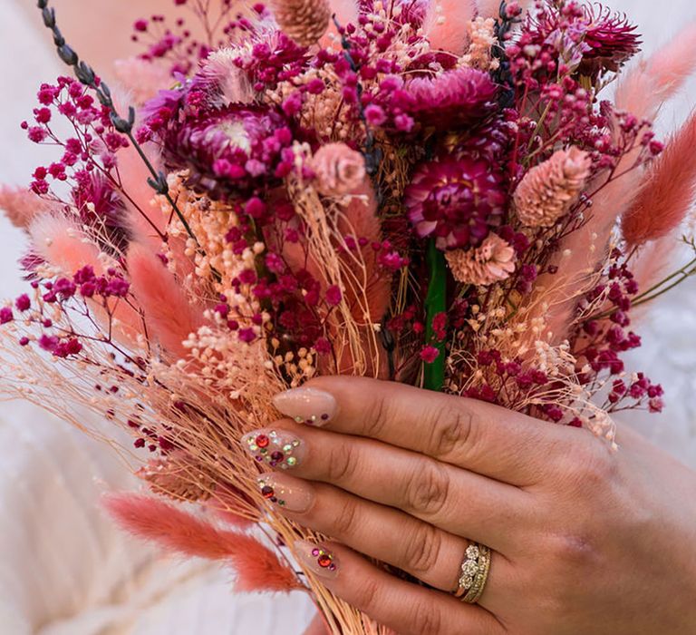 Bride Holding Pink Dried Flower Wedding Bouquet with Bejewelled Wedding Nails