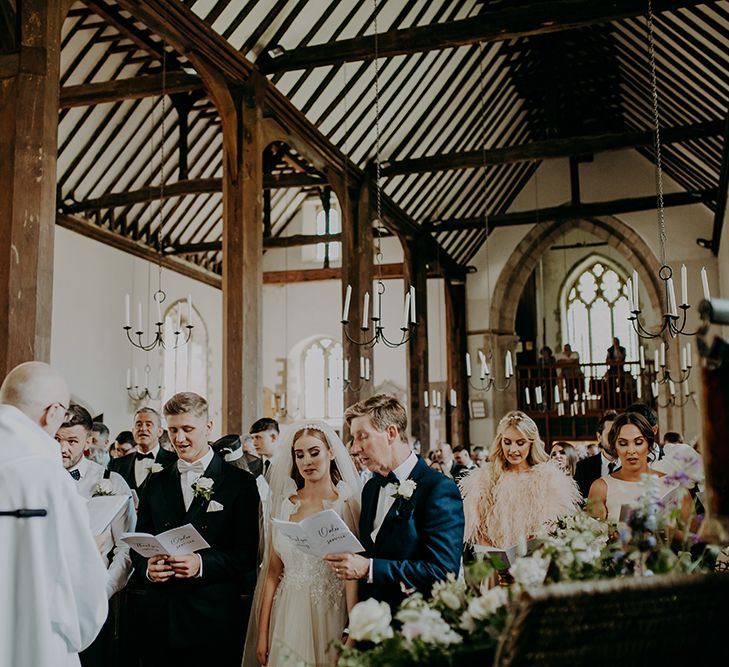 church wedding ceremony with congregation singing hymns 