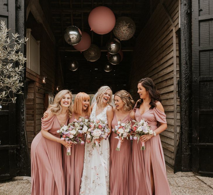 Bridal party outside Upwaltham Barns 