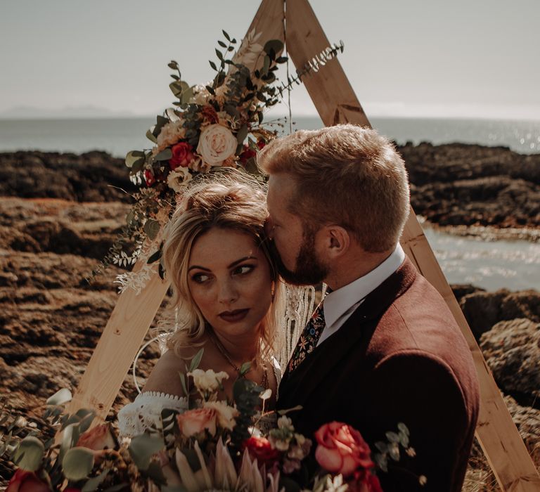 Bride and groom at the picturesque location of Anglesey Island 