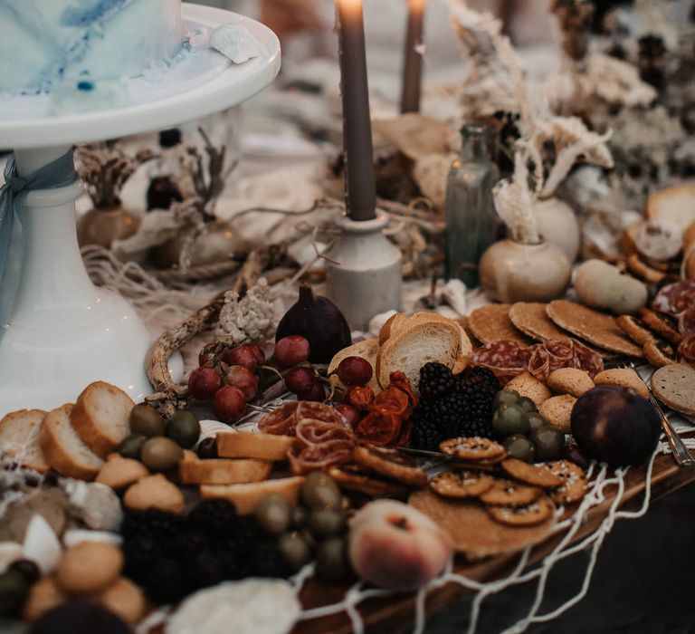 grey taper candles at intimate sweetheart table 