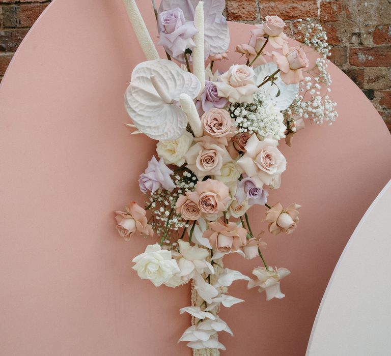 Pastel pink and purple wedding flowers with roses and anthuriums 