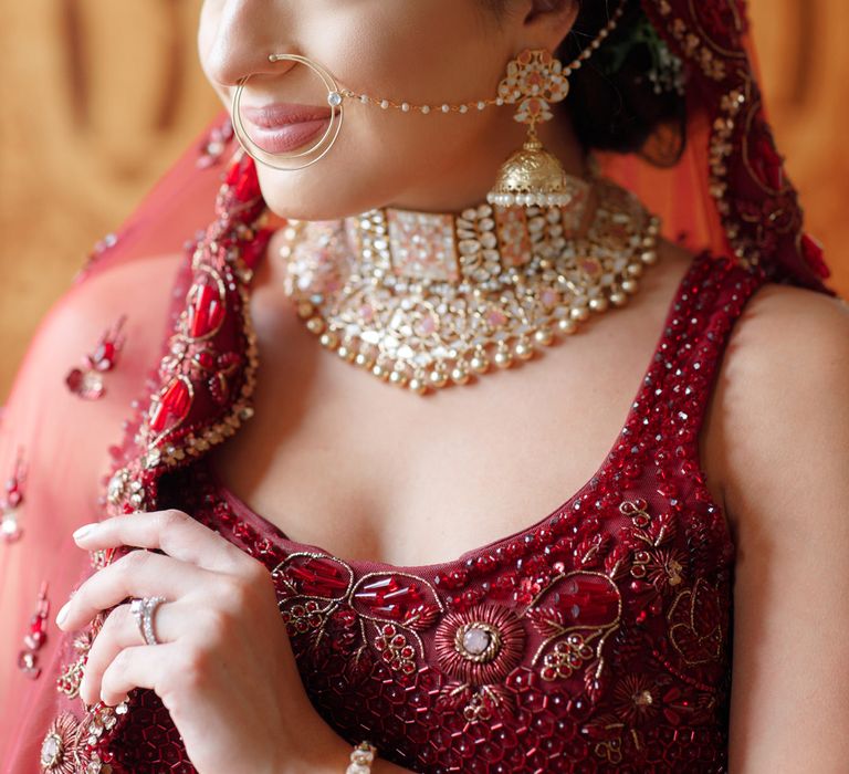 Bride wears golden jewellery on her wedding day