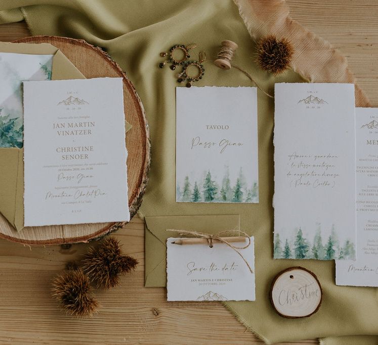 Green and gold wedding stationery suite with pine tree design