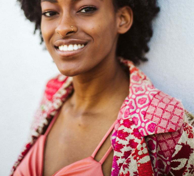 Beautiful black bride-to-be with short afro hair at her engagement session