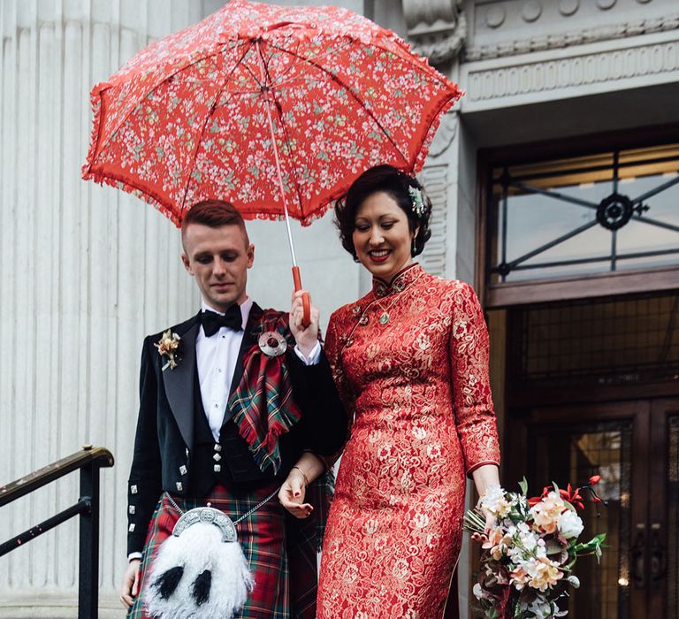 Bride in red and gold cheongsam wedding dress and red shoes