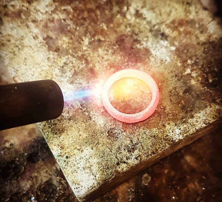 Blowtorch firing metal wedding ring