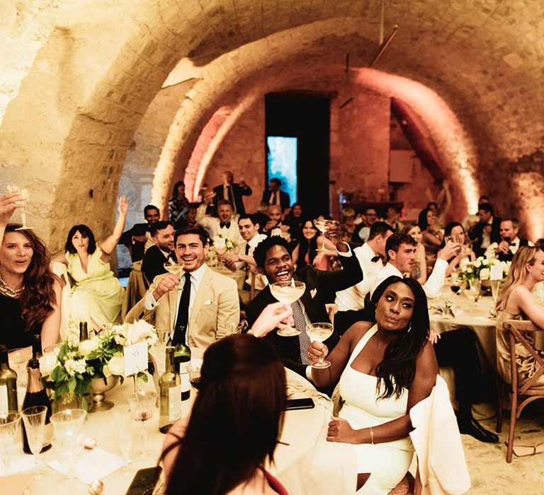 Wedding guests gather during reception meal