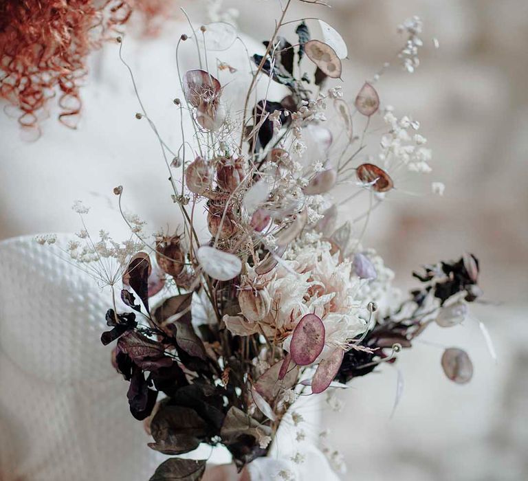 Minimalist wedding bouquet with fragile dried flower stems 