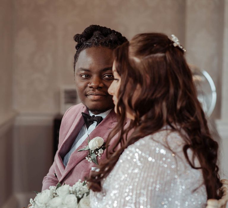 Bride & groom look at one another during ceremony