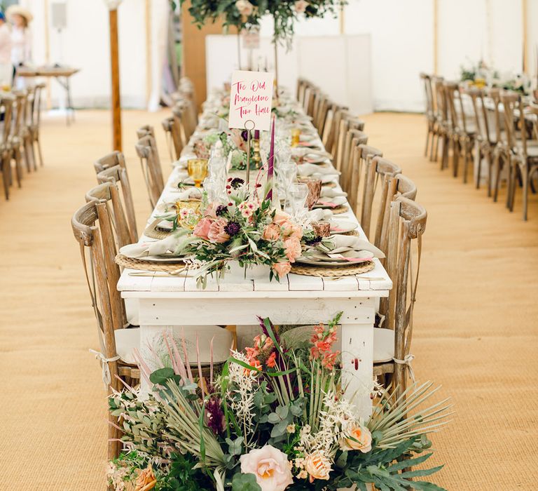 Beautiful pink wedding flower and foliage decor with pampas grass at marquee wedding