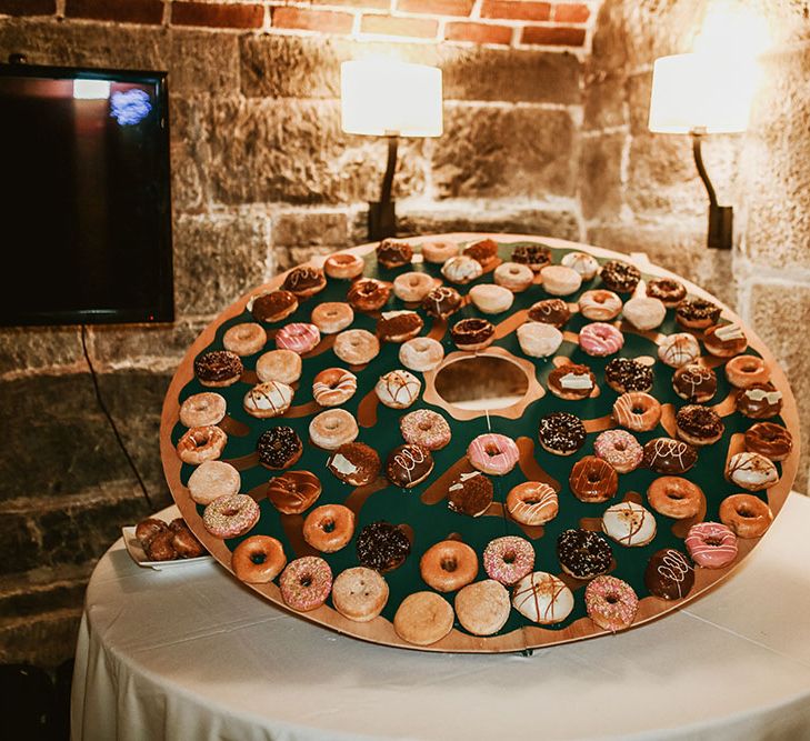 DIY round doughnut wall for Cornwall wedding on the beach