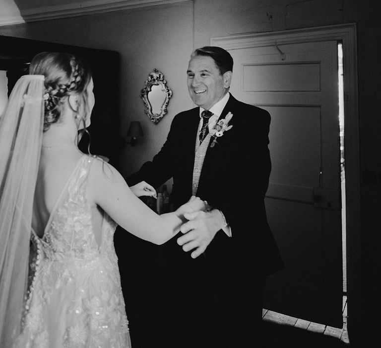 Father sees her daughter for the first time on her wedding day in black & white image