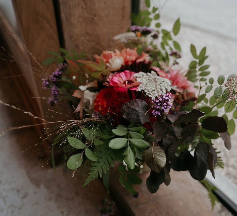 Brightly coloured floral bouquet with green foliage 