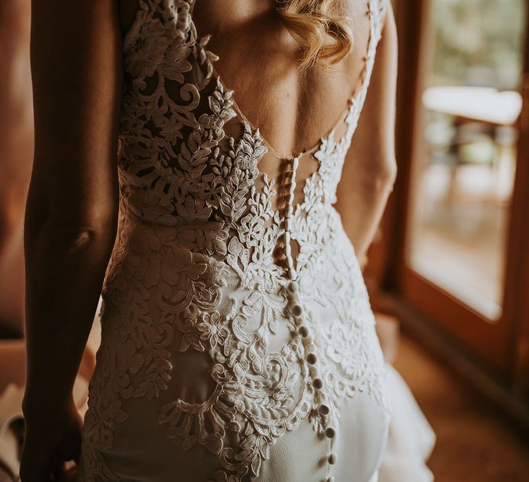 Low back lace detail wedding dress with button detail 