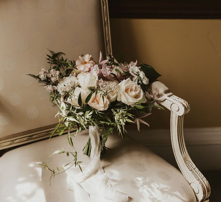 Pink and white wedding bridal  bouquet tied with white satin ribbon 