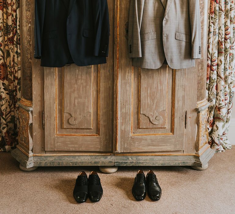 The grooms' suit jackets and Louboutin groom shoes 